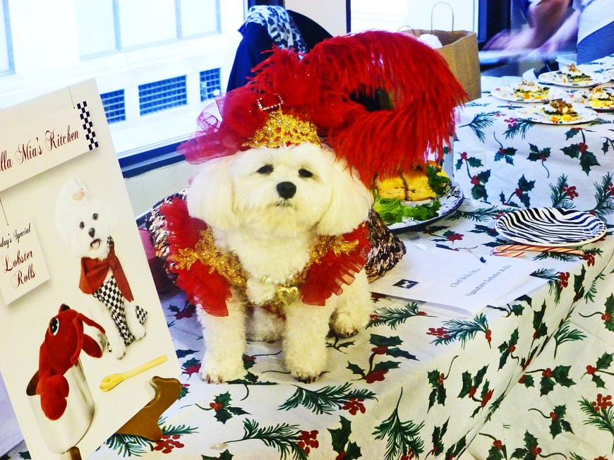 Bella Mia at her table serving Lobster Rolls